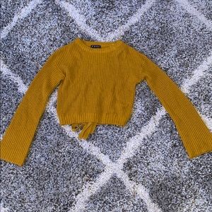 yellow sweater with lace-up back